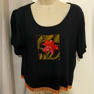 Black blouse with beaded bottom.